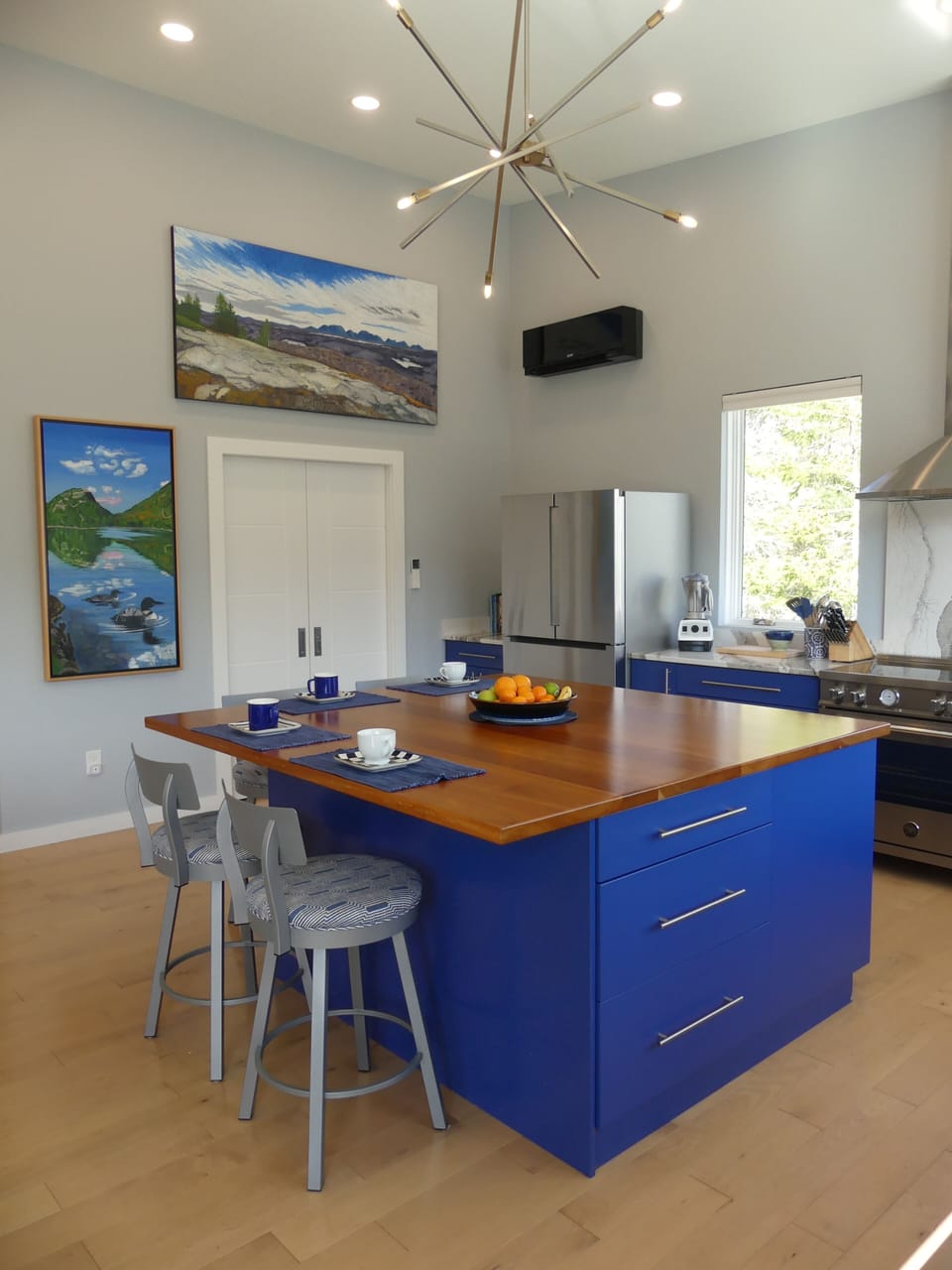 Chef's Kitchen, with large island that seats 4. Art by Maine artists is througho