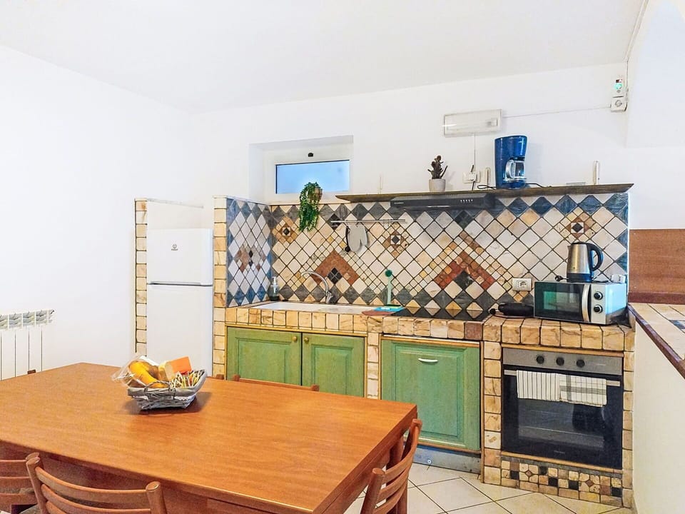 Flooring, Interior Design, Floor, Kitchen, Furniture, Tile, Room, Countertop, Ceiling, Kitchen Stove