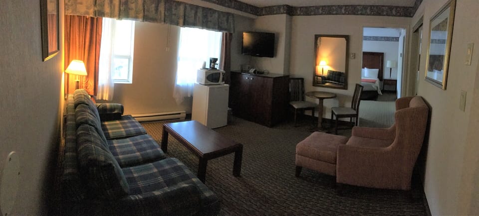 Deluxe King Suite with Sofa bed | Desk, blackout drapes, iron/ironing board, free WiFi