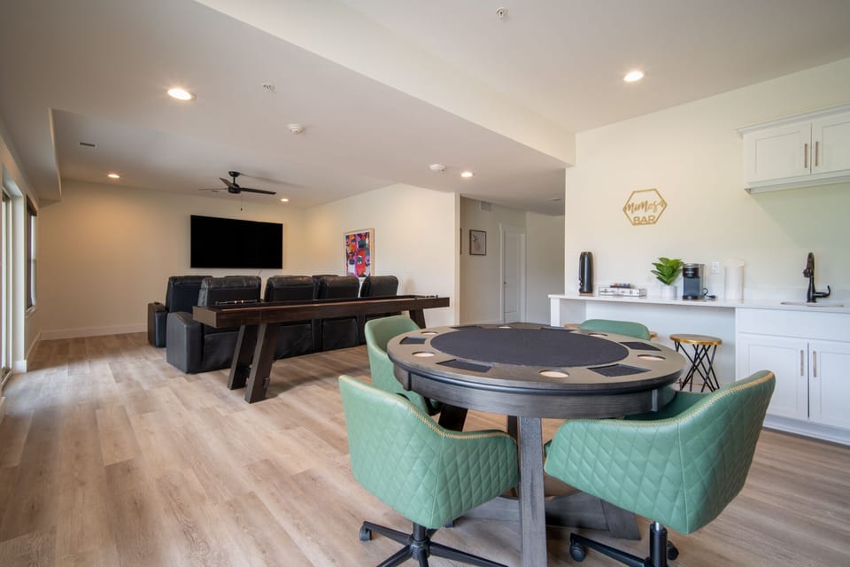 Downstairs Living Area with Poker Table, Table Games, and Theatre Style Seating with Large Screen TV, Patio Access