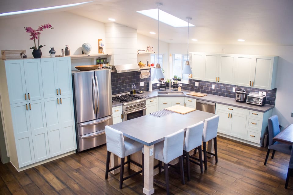 Fully stocked kitchen with microwave built into the island.