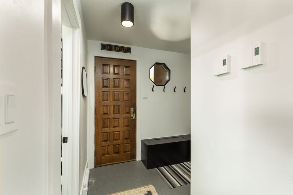 Entry - Entryway with coat hooks and storage seat