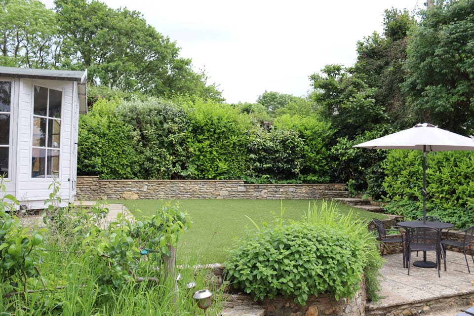 Apple Blossom, Bridport: The spacious back lawn