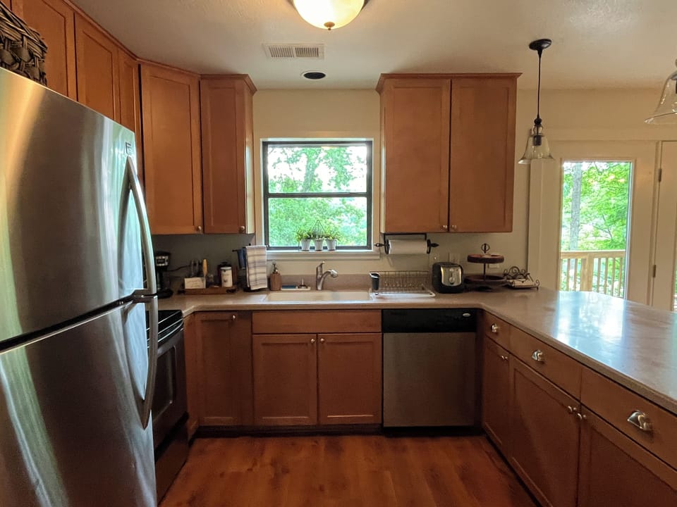 Another view of the kitchen, complete with its own lake view!