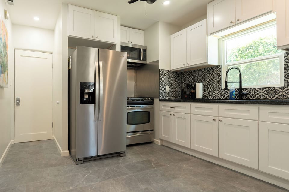 Kitchen with stainless steel appliances and granite counter top