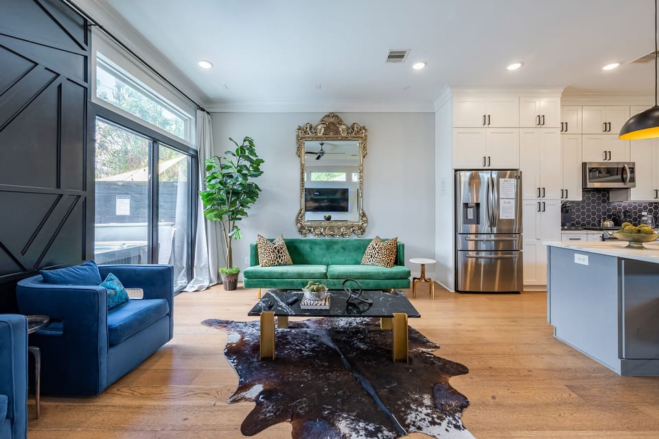 Bright designer living space with gourmet kitchen and patio access