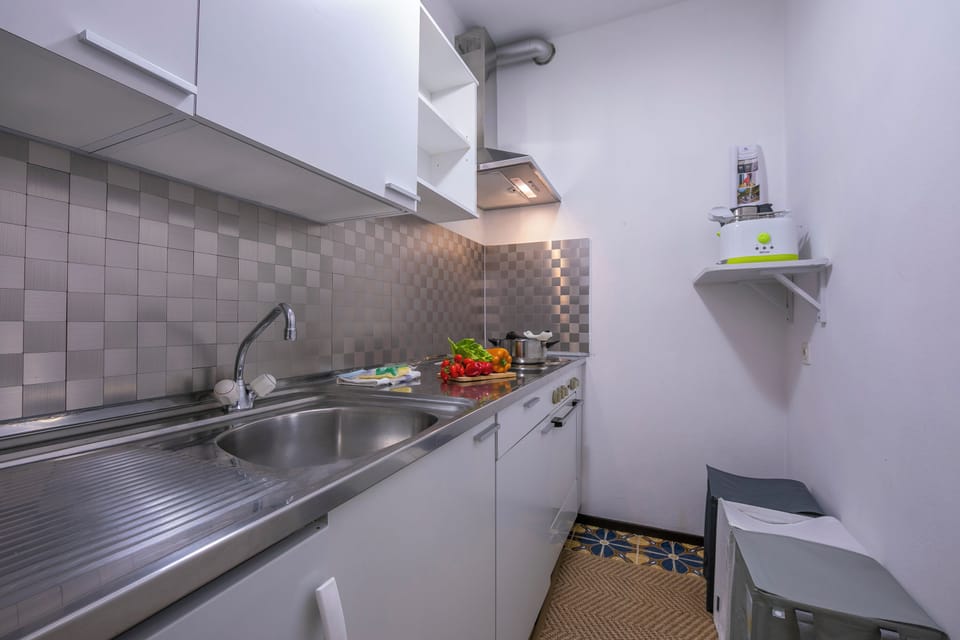 Family Studio (Residence Palace for 3 in Lugano) | Private kitchen | Espresso maker, stovetop, electric kettle, dining table
