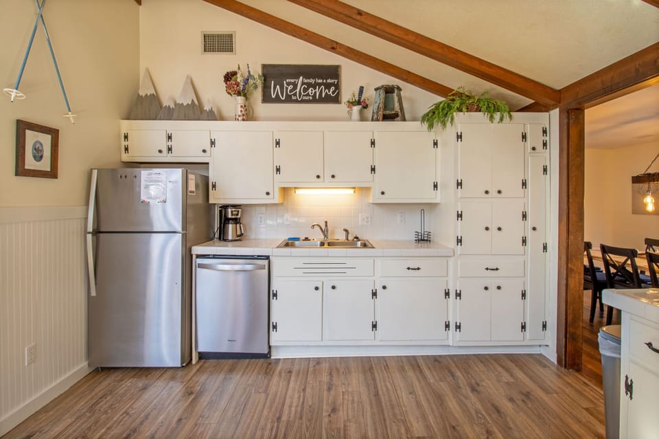 Full kitchen with stove top, oven, microwave, dishwasher, refrigerator, and more