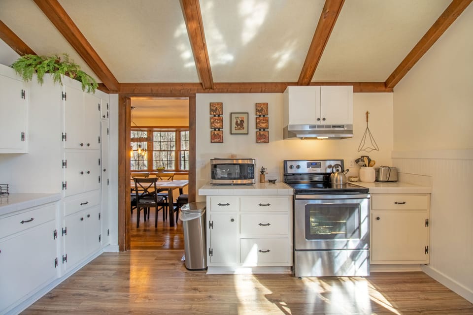 Full kitchen with stove top, oven, microwave, dishwasher, refrigerator, and more