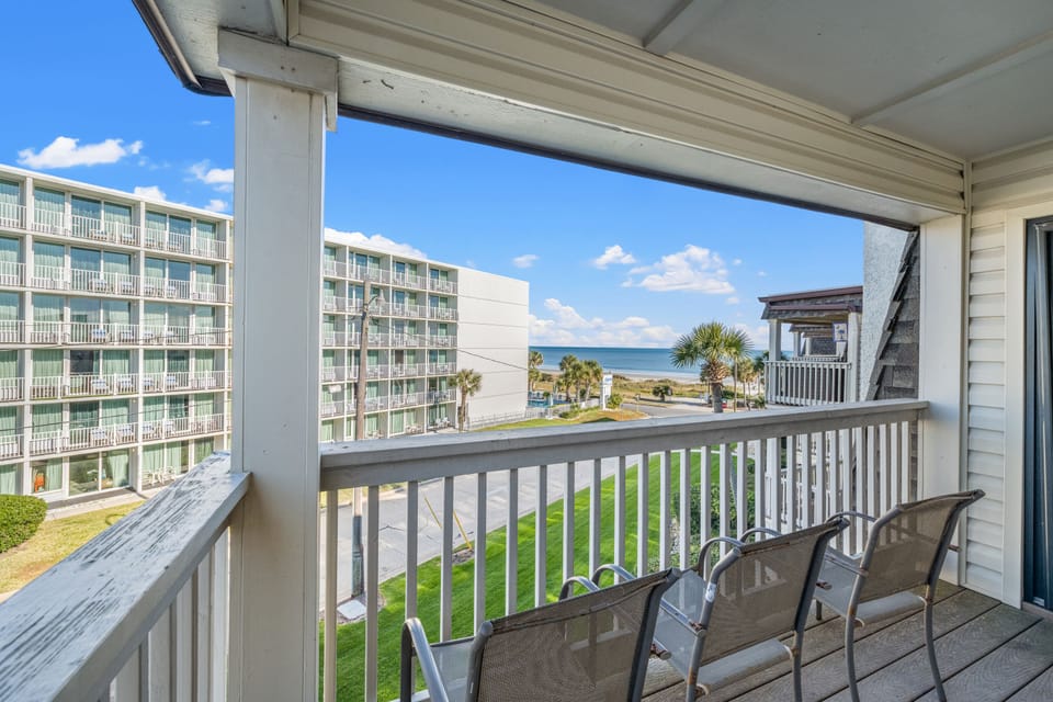 Sit outside and relax on this ocean view balcony and listen to the waves.