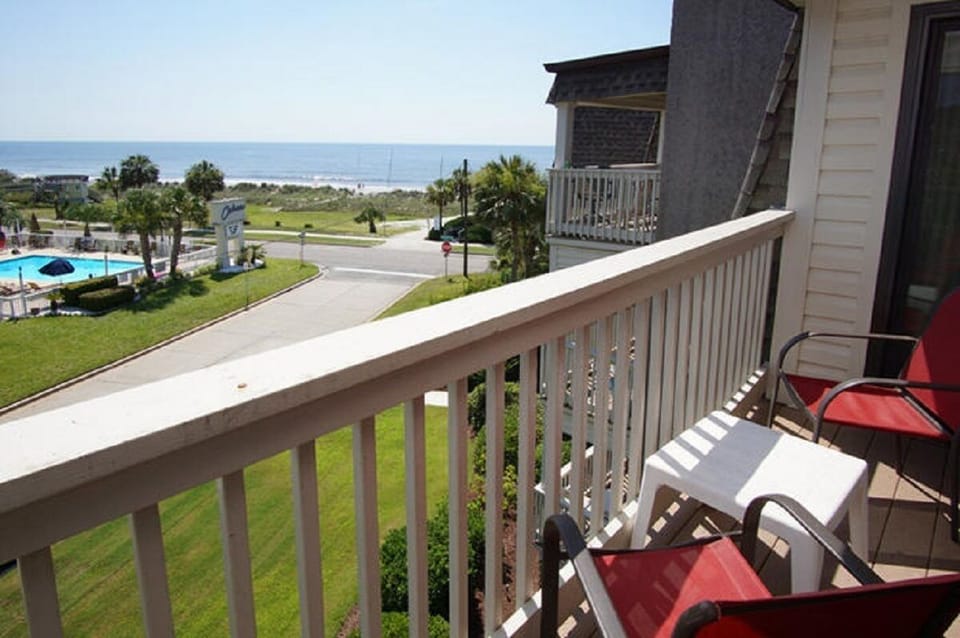Sit outside and relax on this ocean view balcony and listen to the waves.
