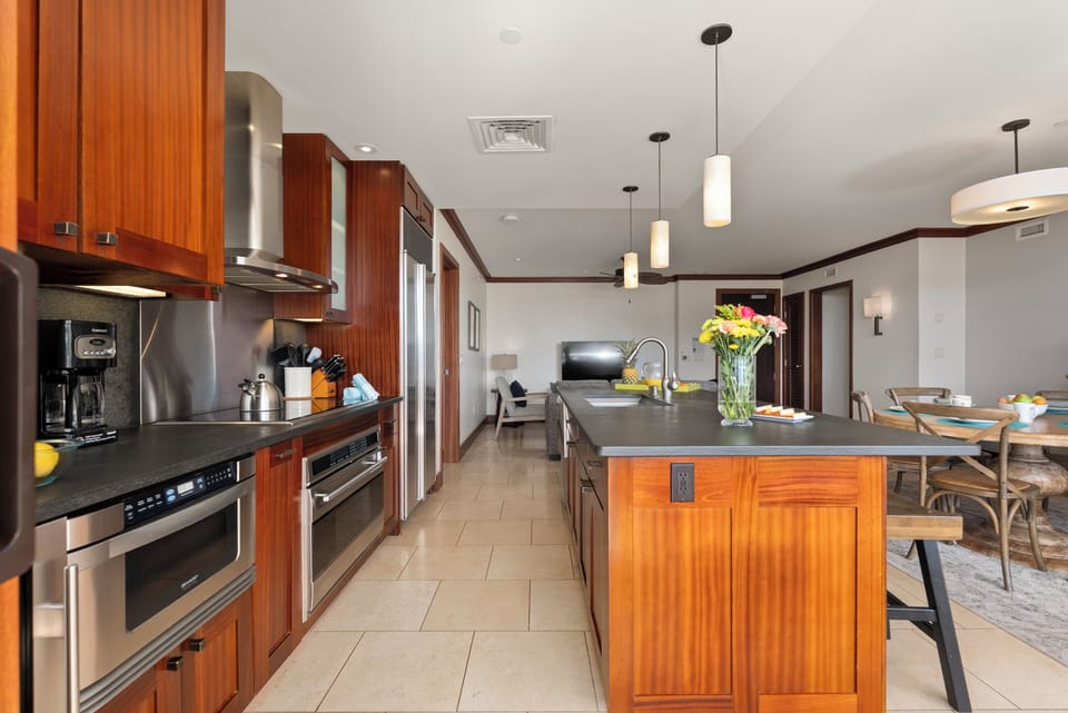 Fully equipped gourmet kitchen with bar seating and an open layout for easy gathering.