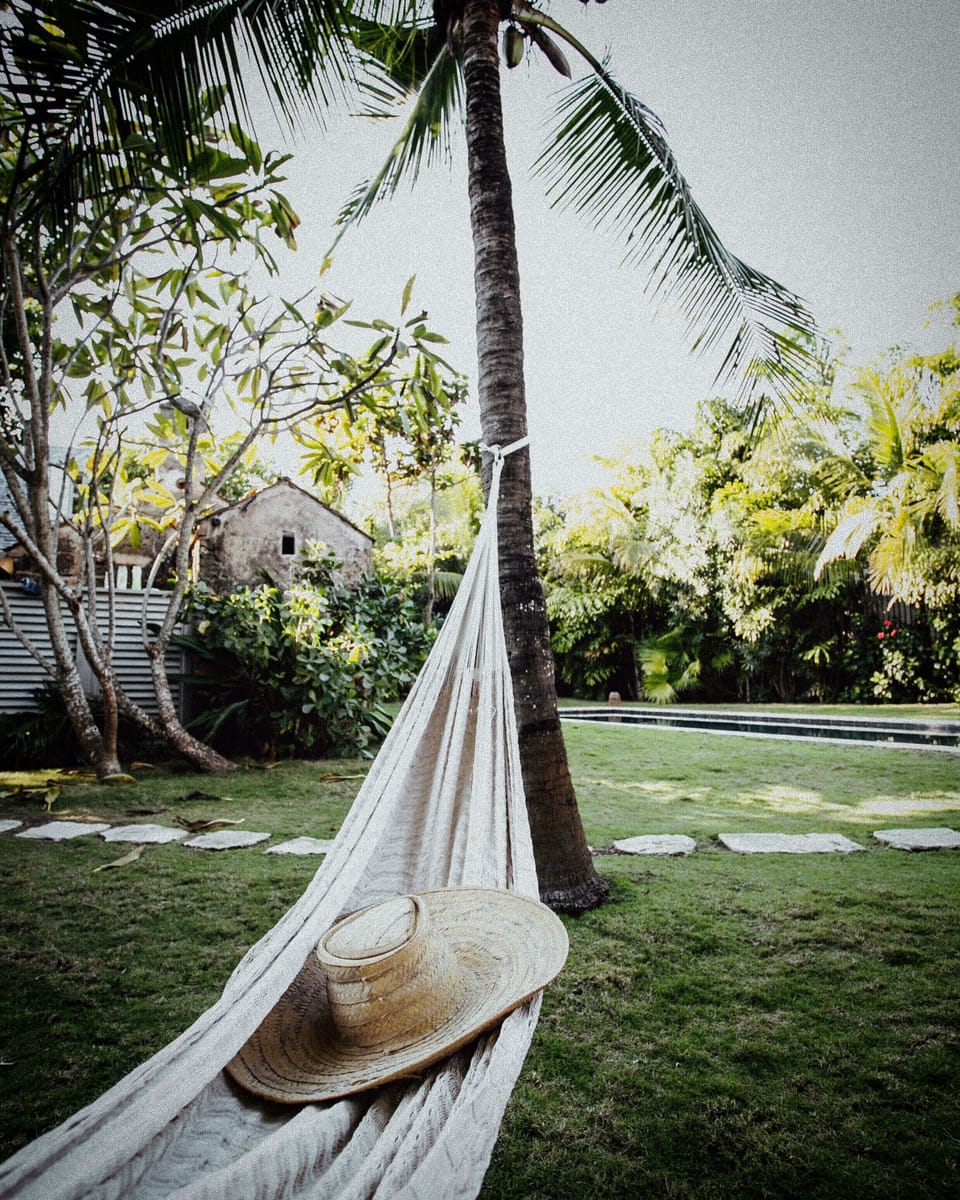 View from hammock of mainhouse to the left and pool. 