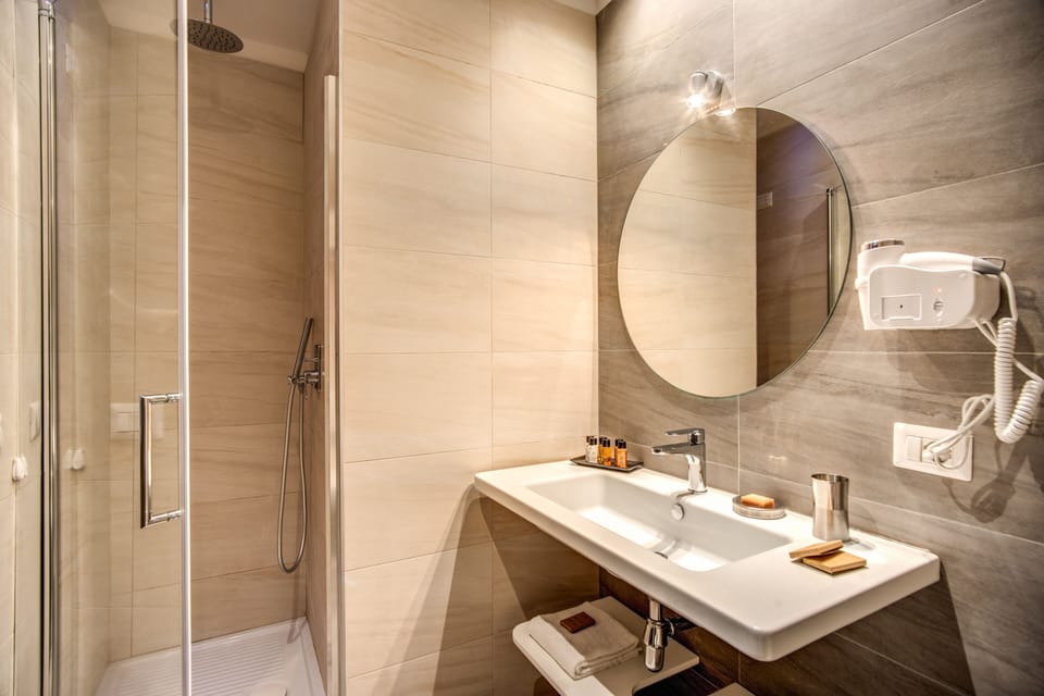 Superior Room | Bathroom | Shower, rainfall showerhead, hair dryer, bathrobes