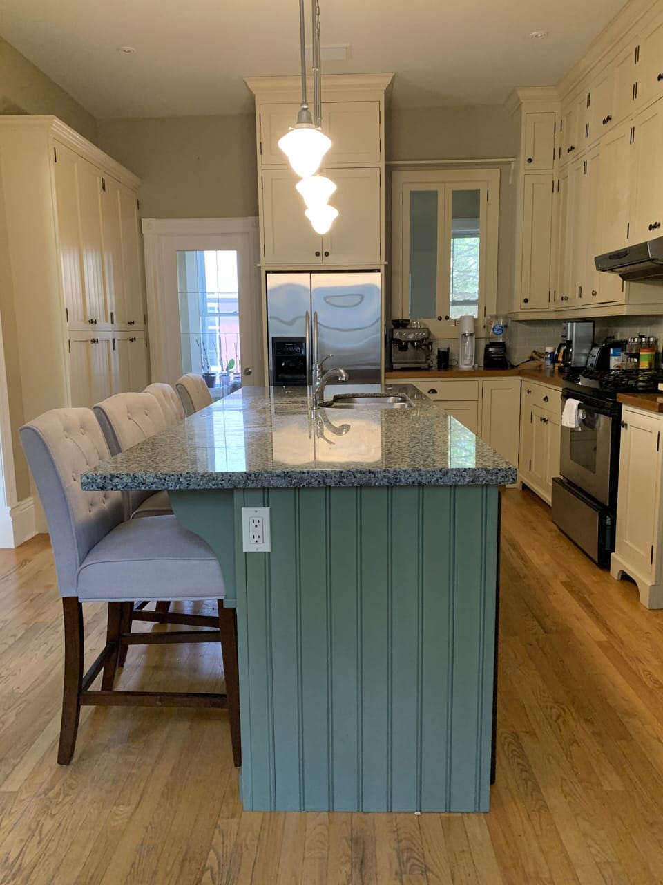 The kitchen. The laundry room is accessed from the door to the left of fridge
