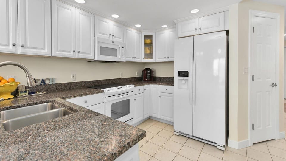 Modern kitchen has new appliances, granite counter tops