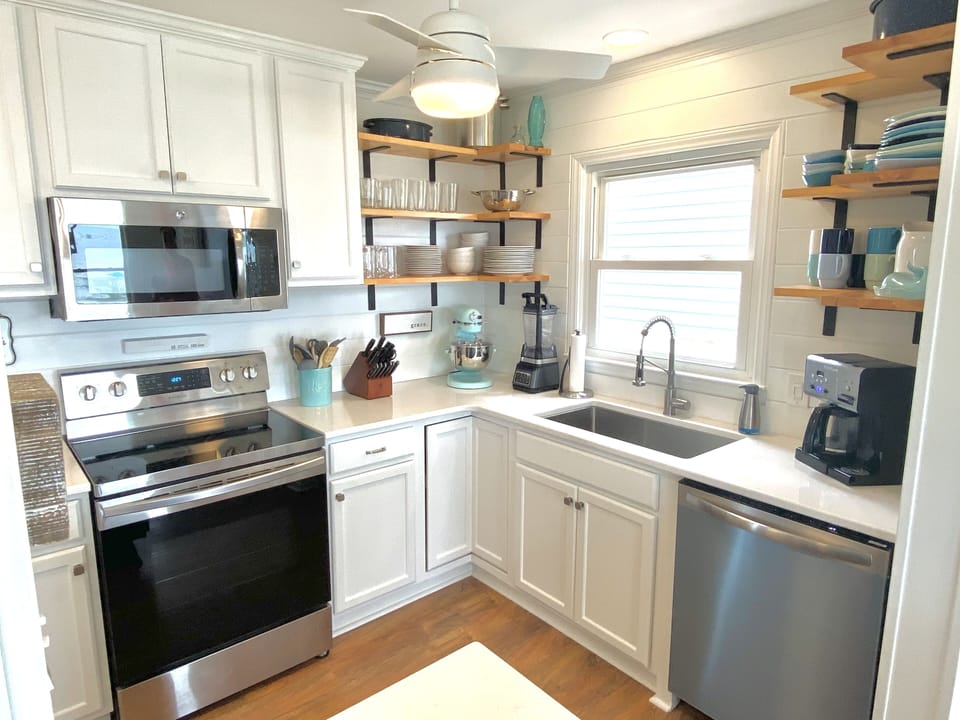 Renovated kitchen w/ new sink/faucet, counters, DW, range, cabinets, shelves…