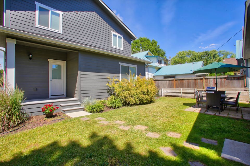 Backyard- Back porch, dining patio w/ seating, BBQ and room to play!!