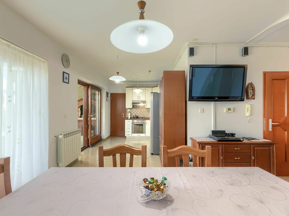 Cabinetry, Furniture, Table, Building, Chair, Television, Interior Design, Drawer, Wood, Lighting