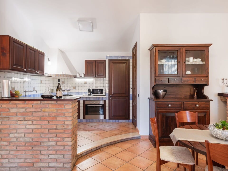Cabinetry, Furniture, Table, Building, Plant, Countertop, Drawer, Wood, Houseplant, Chair