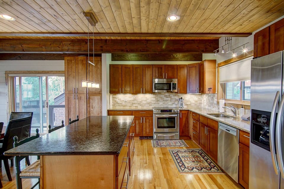 High-end wood finishes make even simple breakfast prep feel luxurious.