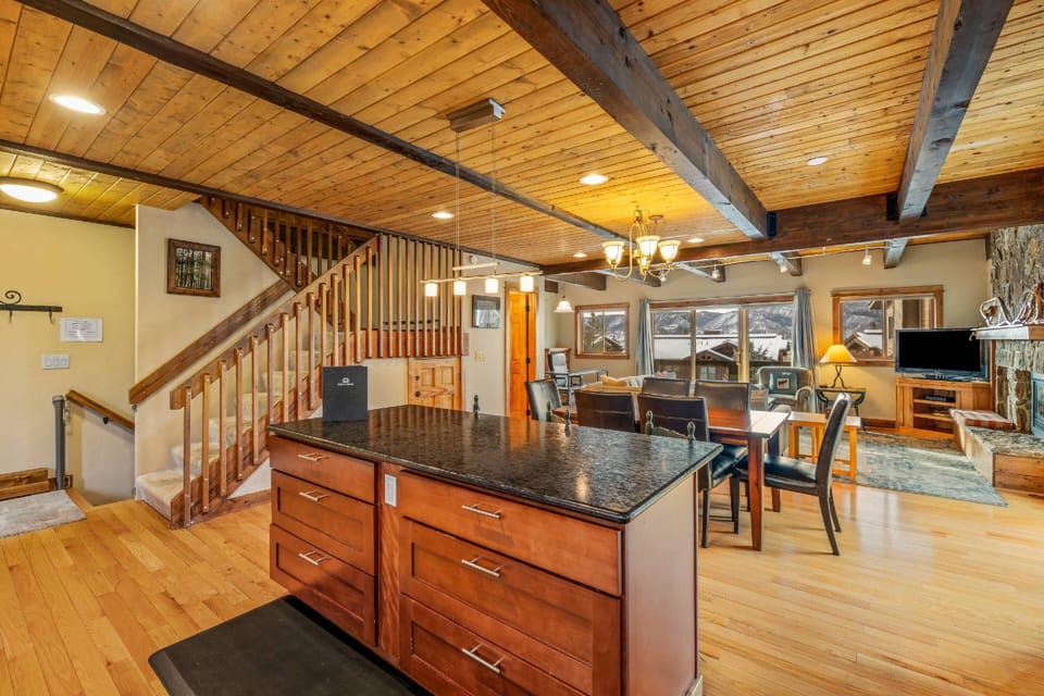 The open-concept layout features beautiful hardwood floors that flow throughout the home.