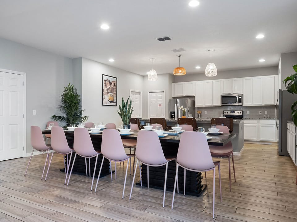 - Spacious dining area with seating for large groups  
- Modern open kitchen with stainless steel appliances  
- Orlando vacation rental perfect for family gatherings