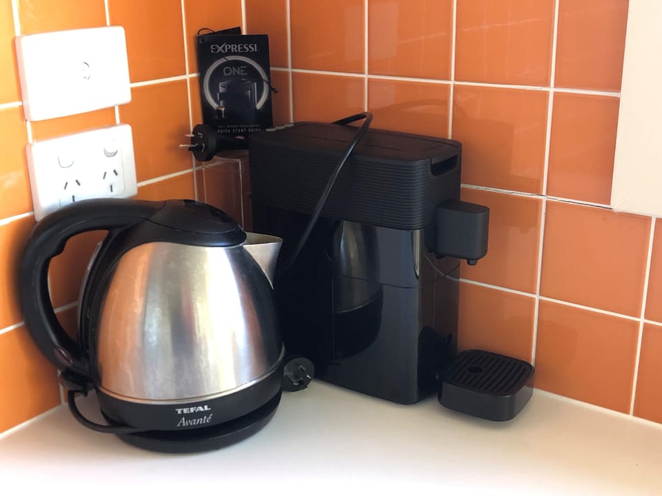 Kettle and coffee machine with switch for stove