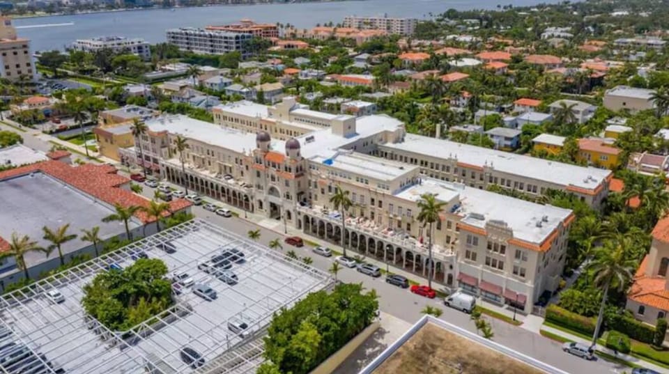 The Palm Beach Hotel is a true Historic Landmark showcasing stunning double bell tower Spanish Baroque architecture that exudes old-world glamour and the charm of a bygone era. Fun fact: Publix is conveniently located just across the street.