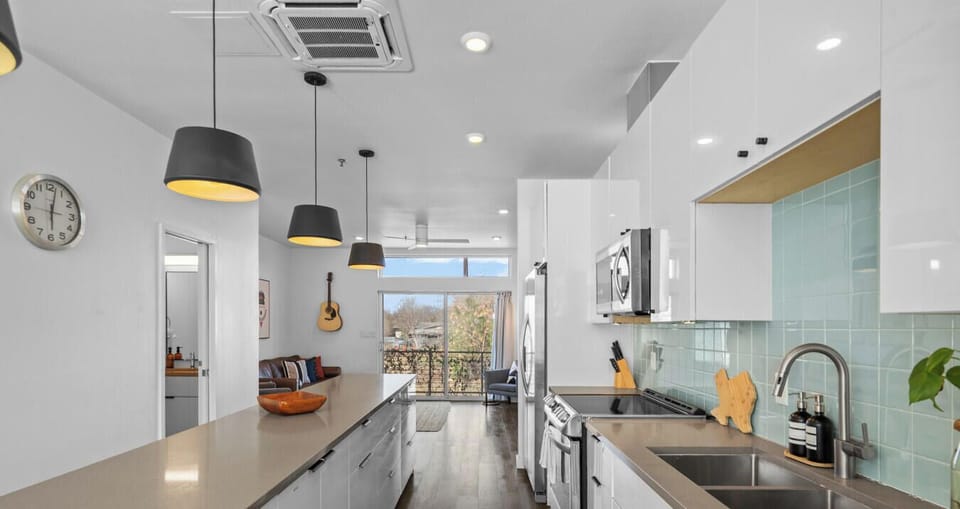 Long island, bright finishes, and a straight shot to the living room.