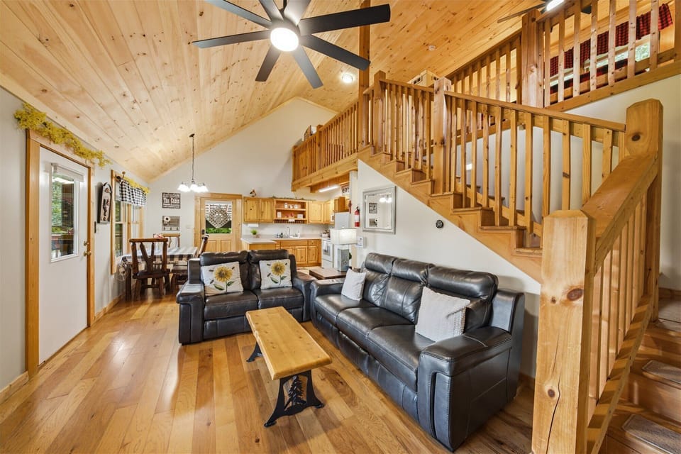 Living room w/leather sofas, TV with YouTubeTV, stocked kitchen, dining room.