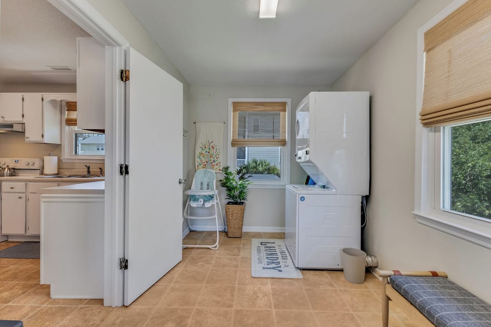 Laundry with washer and dryer. High chair for babies and toddlers.