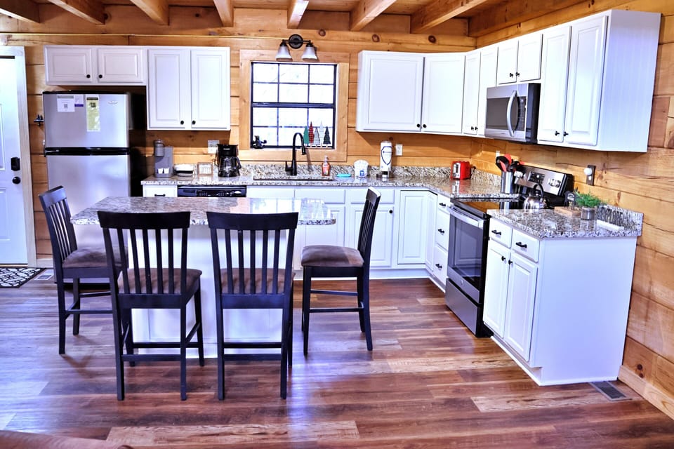 Fully stocked kitchen with drip coffee maker and Keurig.