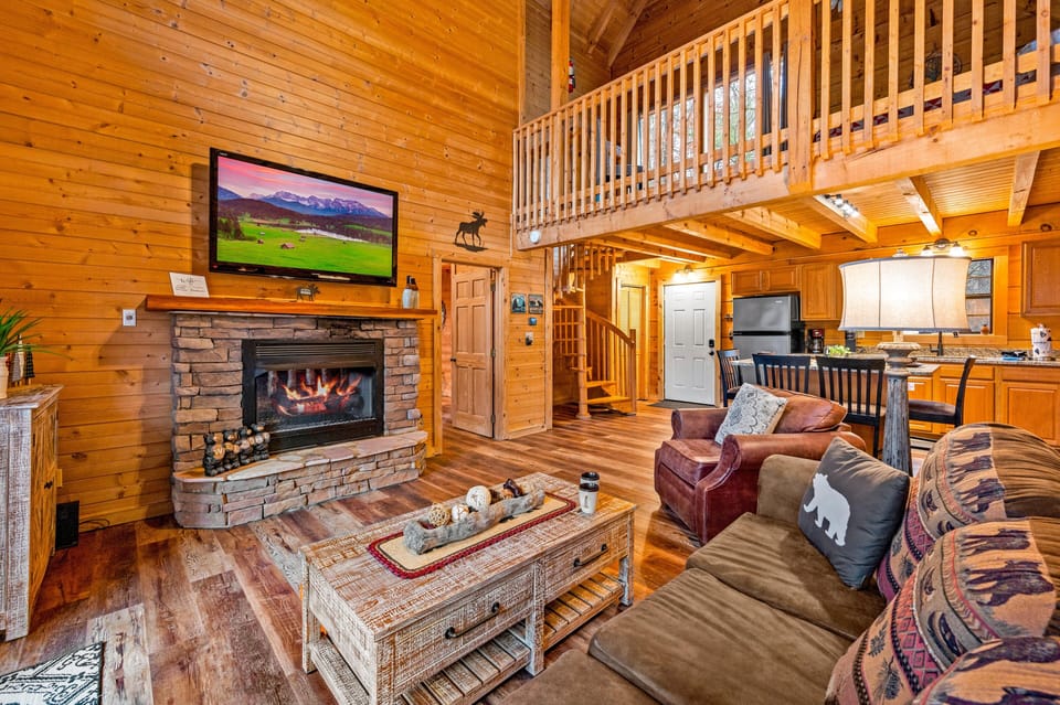 Family room with loft stairs and laundry closet near the front door.