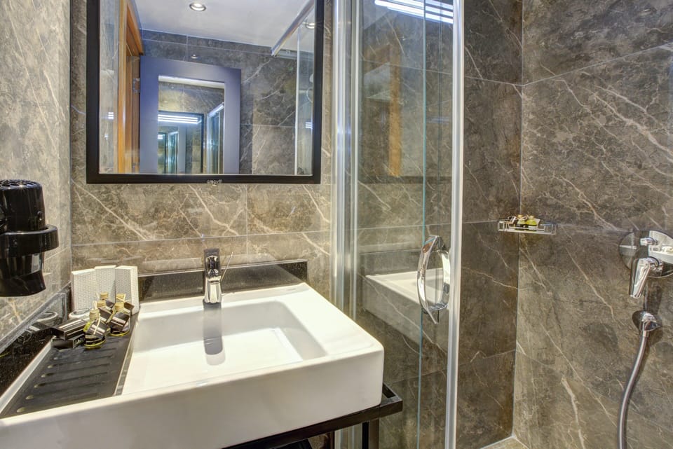 Shower, eco-friendly toiletries, hair dryer, slippers