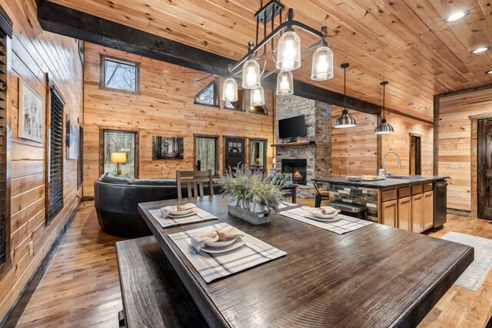 Open family style dining space with combo seating for 8. Decor may change.