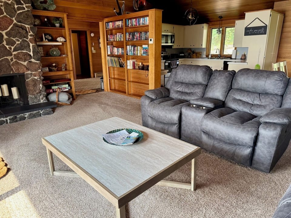 Main floor living room with a deck to oversee the beautiful lake view!