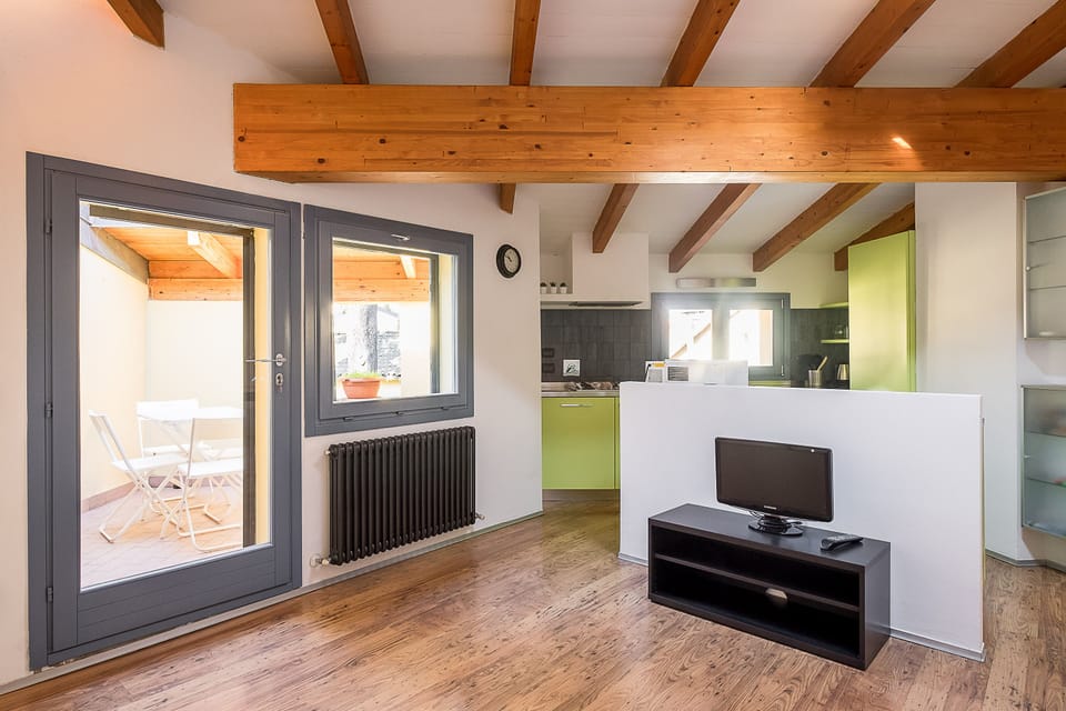City Condo | Living area | Flat-screen TV