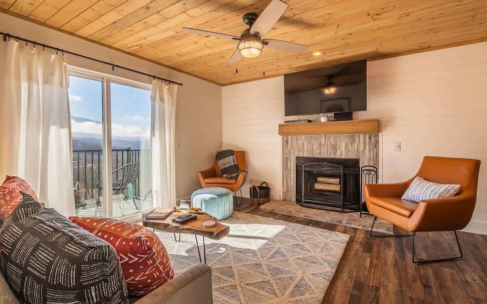 The real-wood fireplace is ready to be utilized during the cooler months.
