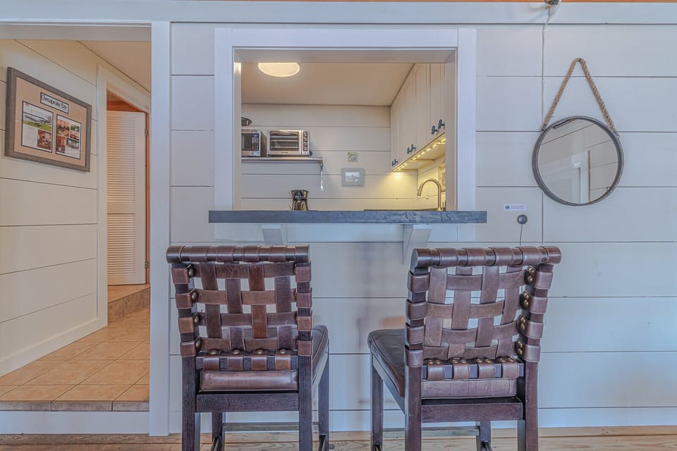 Kitchenette is on the other side of the pass through. Bathroom is on the left.
