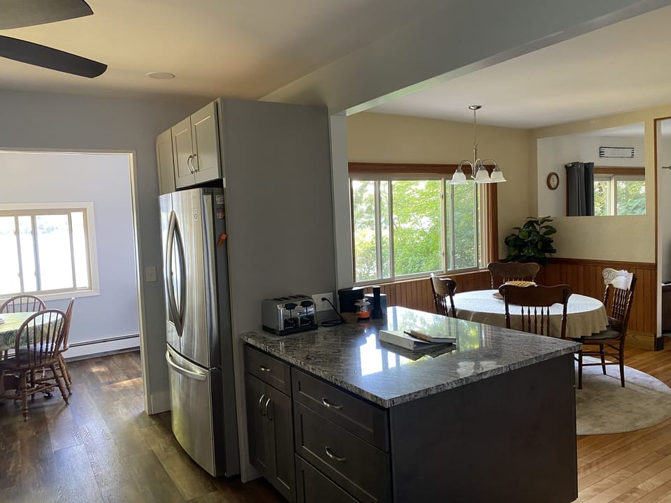 Open concept kitchen, dining and living rooms