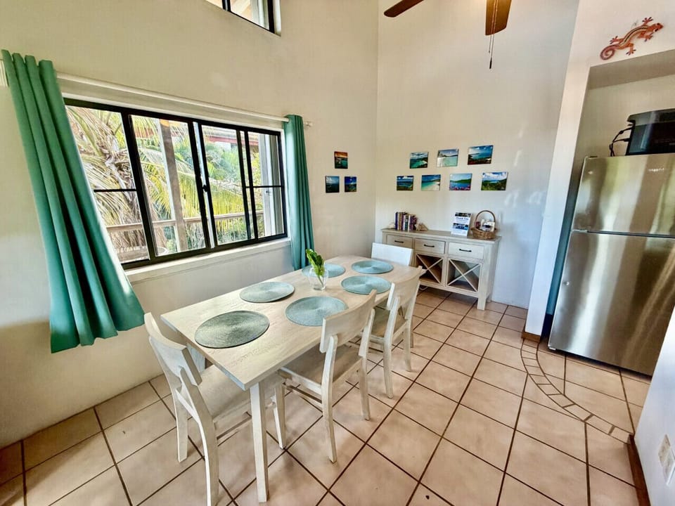 Dining area between the kitchen and living room with a new ceiling fan and incredible view