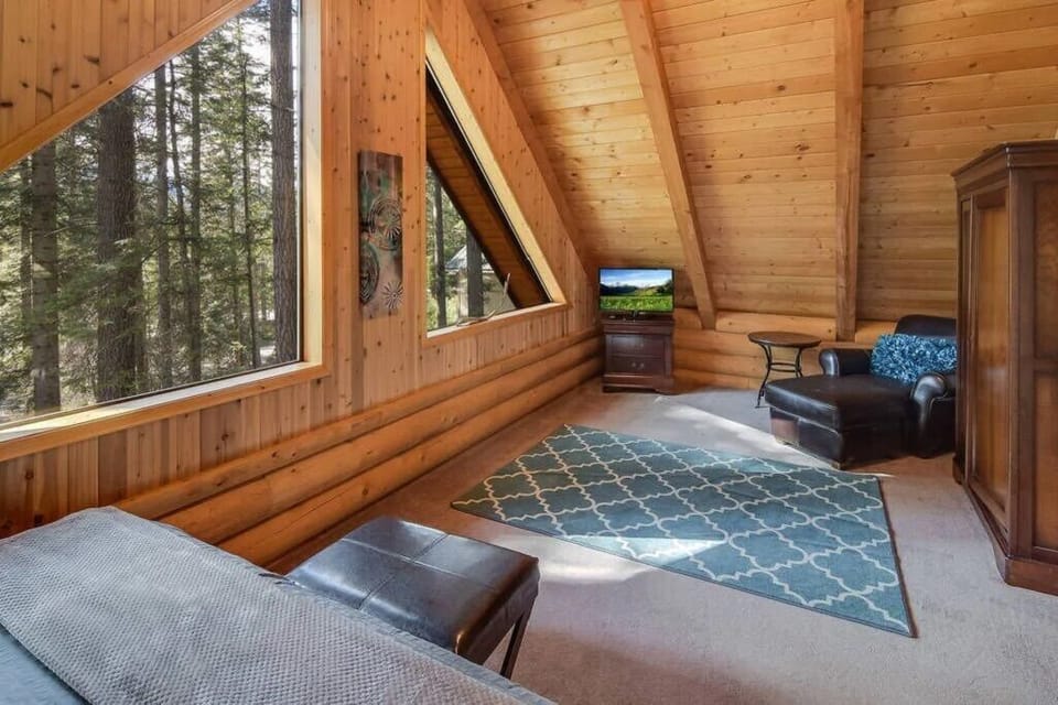 Sitting area of upstairs bedroom to take in the forest views.