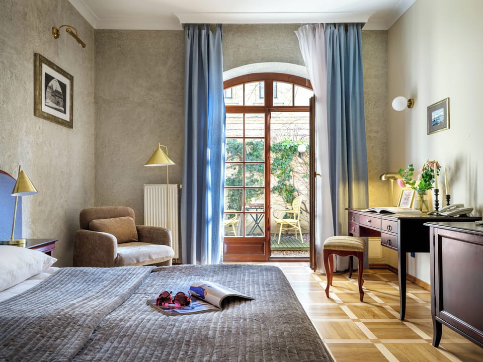 Superior Double Room | Minibar, in-room safe, individually decorated, desk