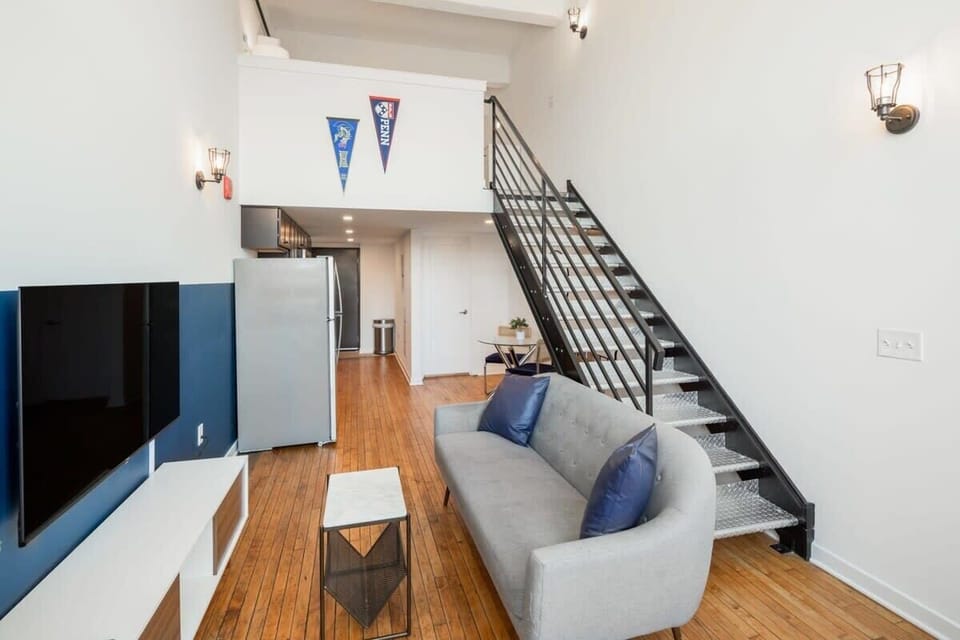 Spacious living area with tall windows