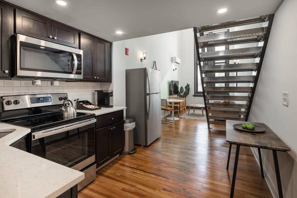 Enjoy home-cooked or the neighborhood's best takeout in this lovely kitchen with stainless steel appliances and a full-sized refrigerator