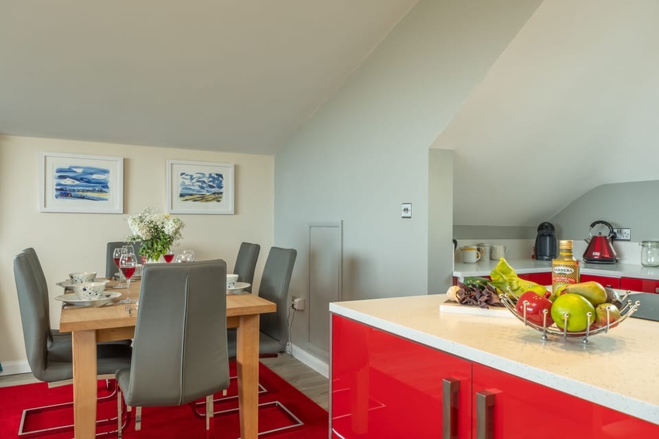 First floor: A colourful kitchen and dining area