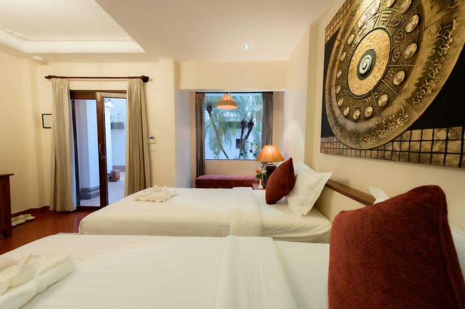 Deluxe Room, River View (Ground Floor) | In-room safe, WiFi (free), bed sheets