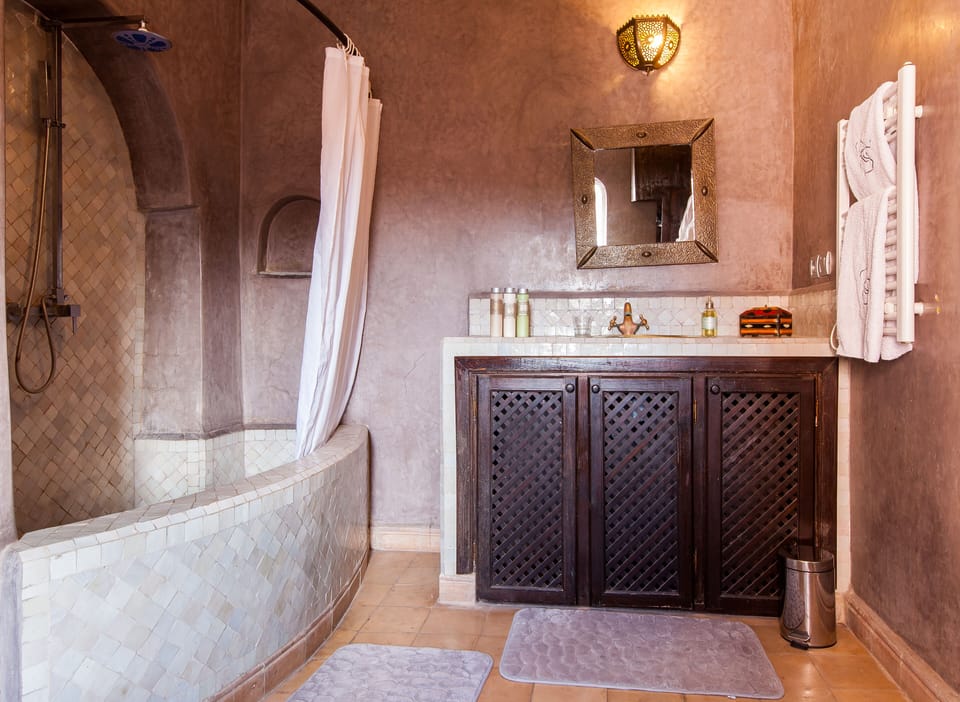 Executive Suite | Bathroom | Shower, hair dryer, bathrobes, towels