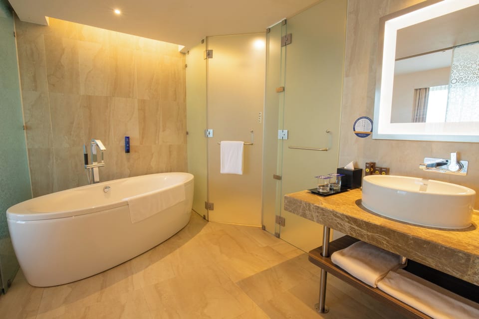 Shower, rainfall showerhead, designer toiletries, hair dryer